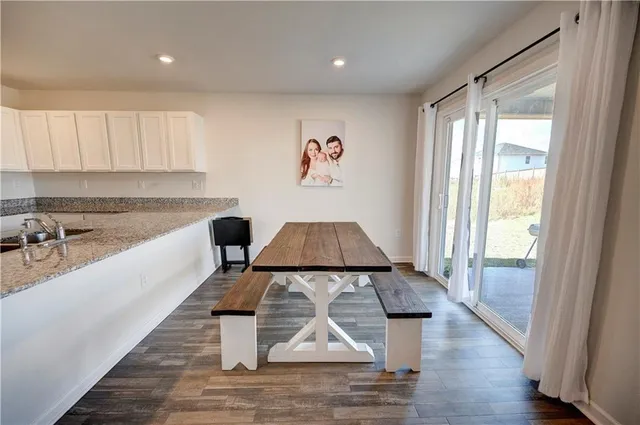 a kitchen with a sink and a stove top oven