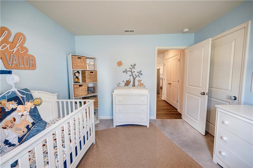 500 Pemberton Street Kingston, GA 30145 - Photo 20 of 46 a bedroom with furniture and a baby crib