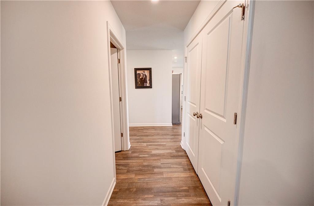 500 Pemberton Street Kingston, GA 30145 - Photo 22 of 46 a view of a hallway with wooden floor and staircase