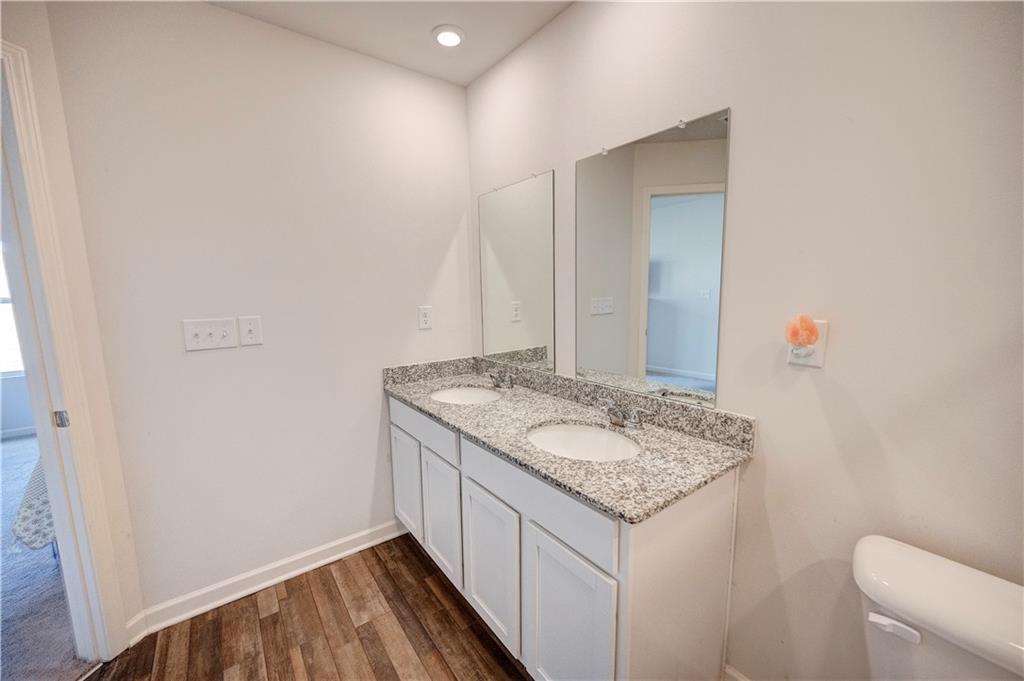 500 Pemberton Street Kingston, GA 30145 - Photo 30 of 46 a bathroom with a granite countertop sink and a mirror