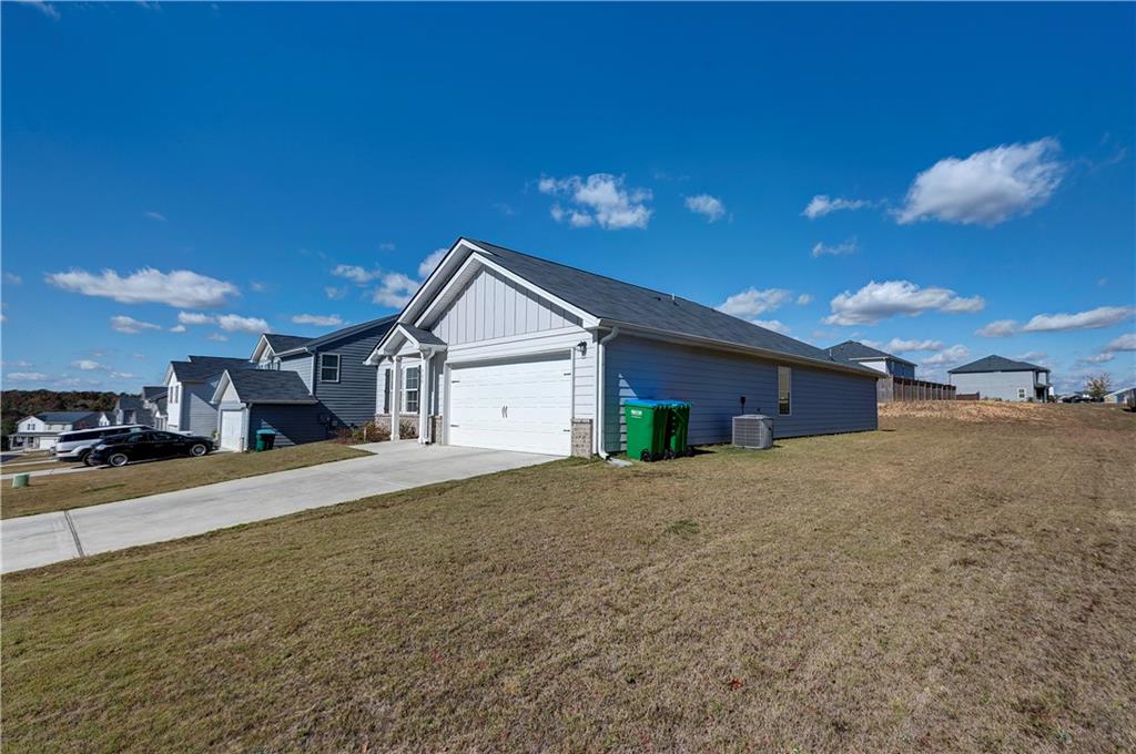 500 Pemberton Street Kingston, GA 30145 - Photo 34 of 46 a view of a house with a yard and garage