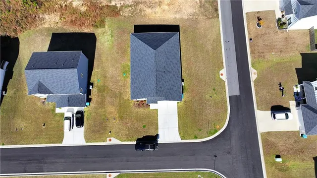 an aerial view of residential houses with swimming pool