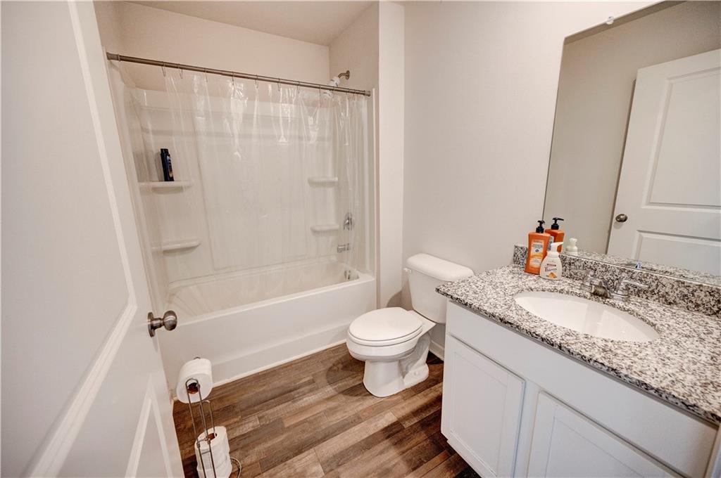 500 Pemberton Street Kingston, GA 30145 - Photo 4 of 46 a bathroom with a granite countertop sink toilet and shower