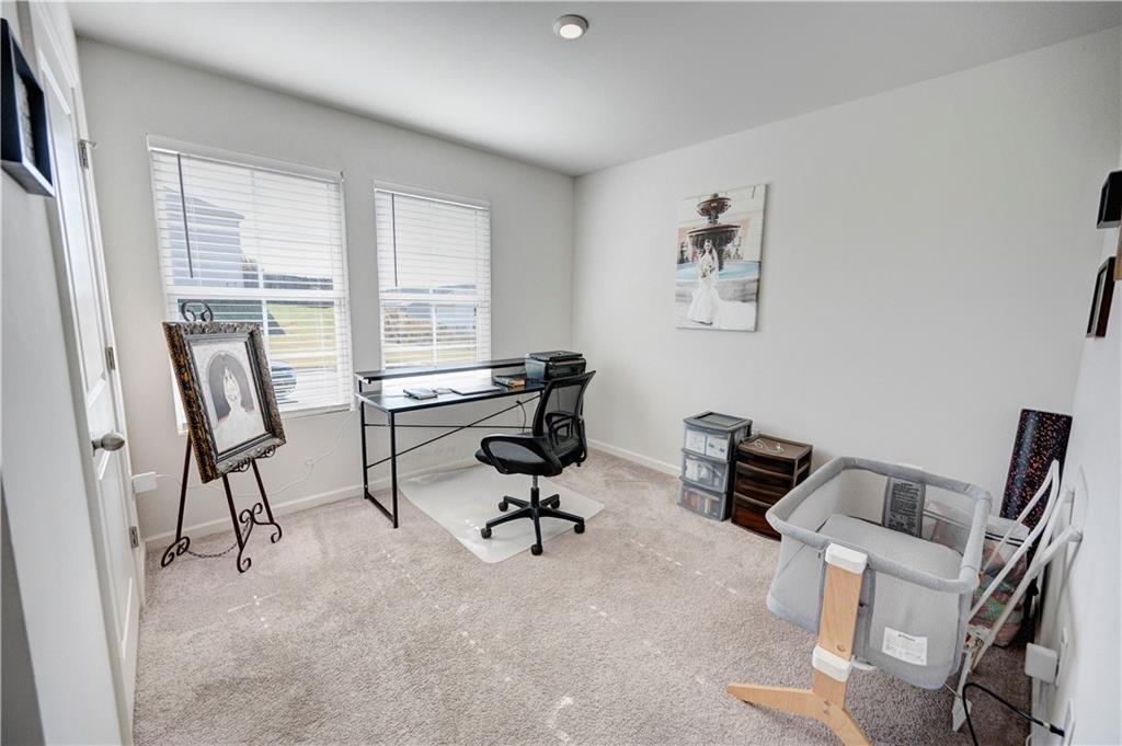 500 Pemberton Street Kingston, GA 30145 - Photo 7 of 46 a view of a workspace with furniture and a window