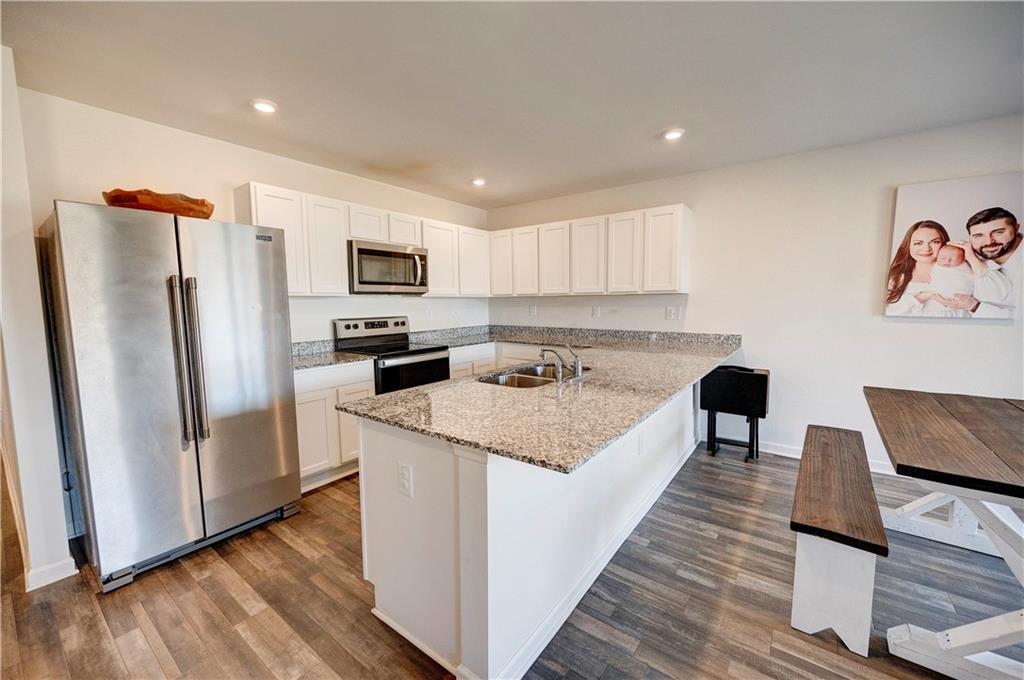 500 Pemberton Street Kingston, GA 30145 - Photo 10 of 46 a large kitchen with stainless steel appliances granite countertop a refrigerator a stove top oven a sink and dishwasher