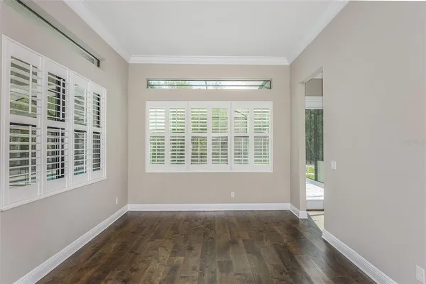 a view of an empty room with a window