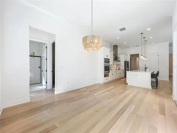 a view of a kitchen with microwave and cabinets