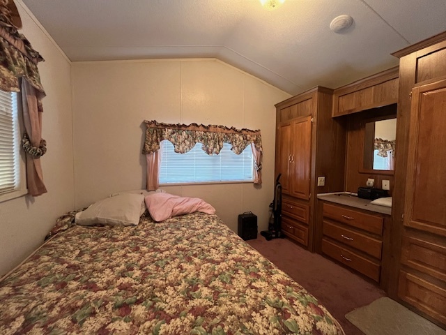 2795 East 28th Road Marseilles, IL 61341 - Photo 12 of 57 a bedroom with a bed and dresser with mirror