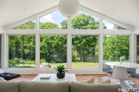 a living room with a couch and a large window