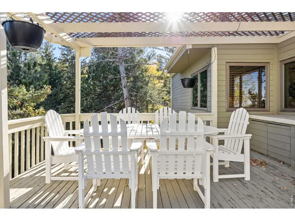 a view of a chairs and table on the terrace