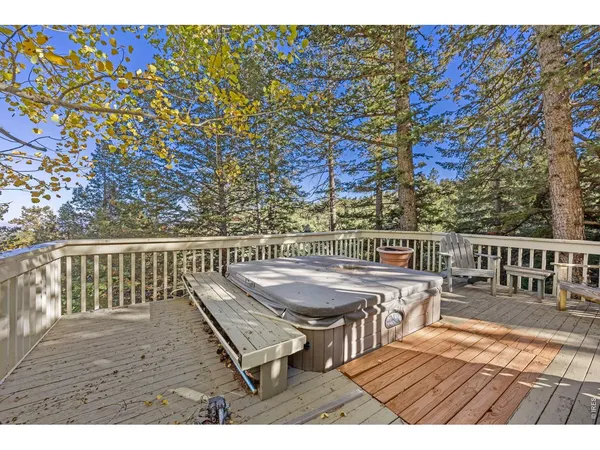 a view of balcony with wooden floor and outdoor seating