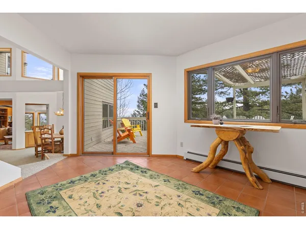 a view of a livingroom with furniture wooden floor and a window