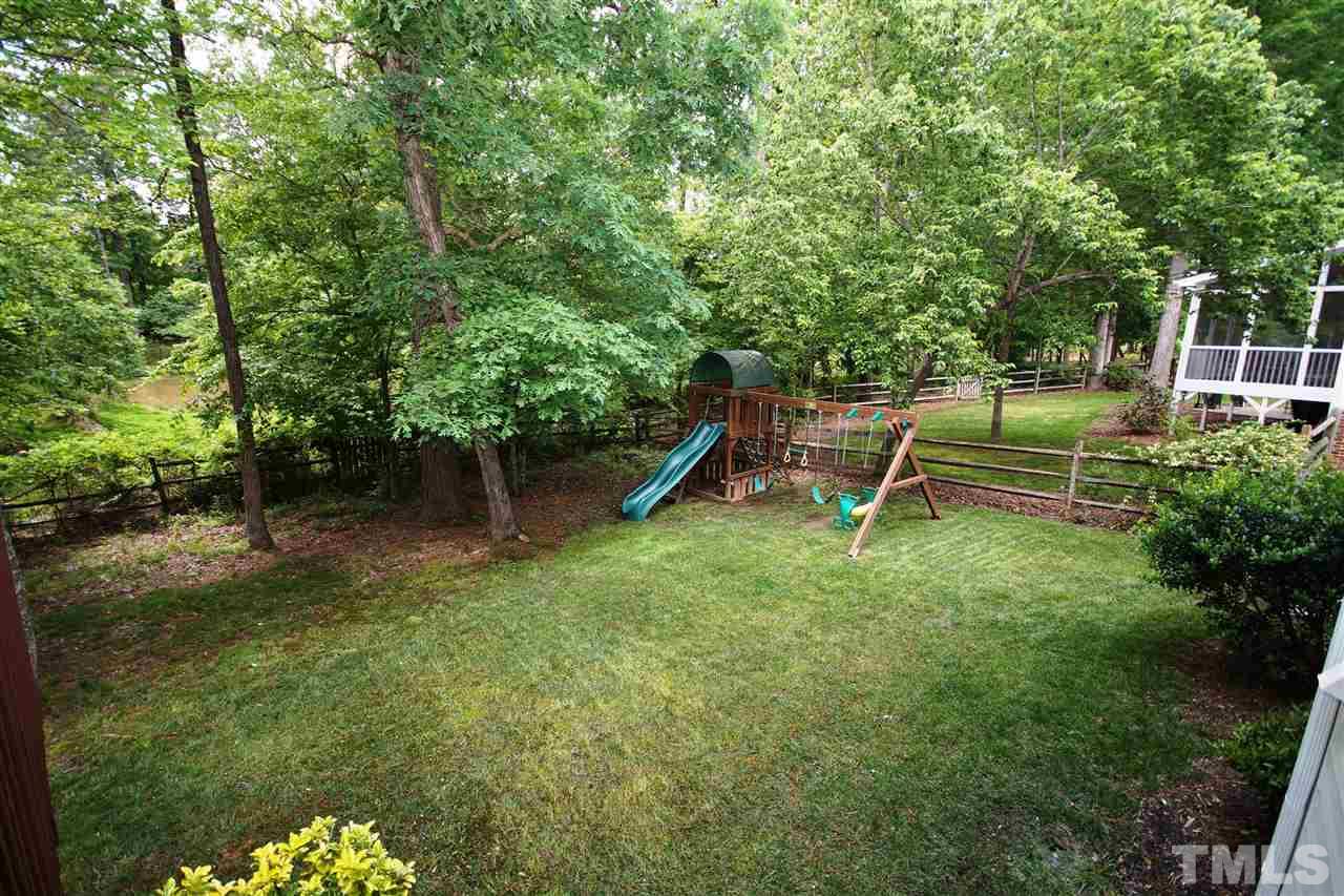 9241 Shallcross Way Raleigh, NC 27617 - Photo 21 of 22 a front view of a house with a yard