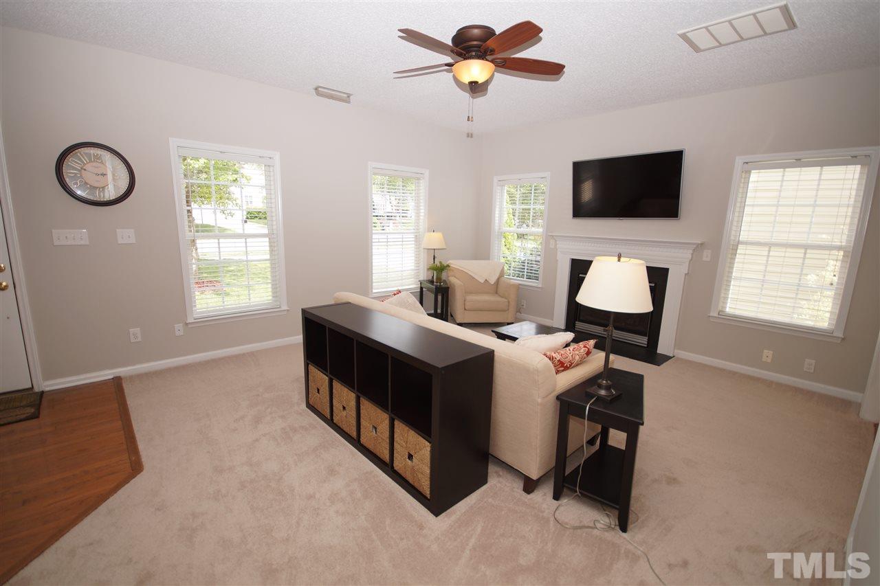 9241 Shallcross Way Raleigh, NC 27617 - Photo 5 of 22 a view of a livingroom with workspace and a window