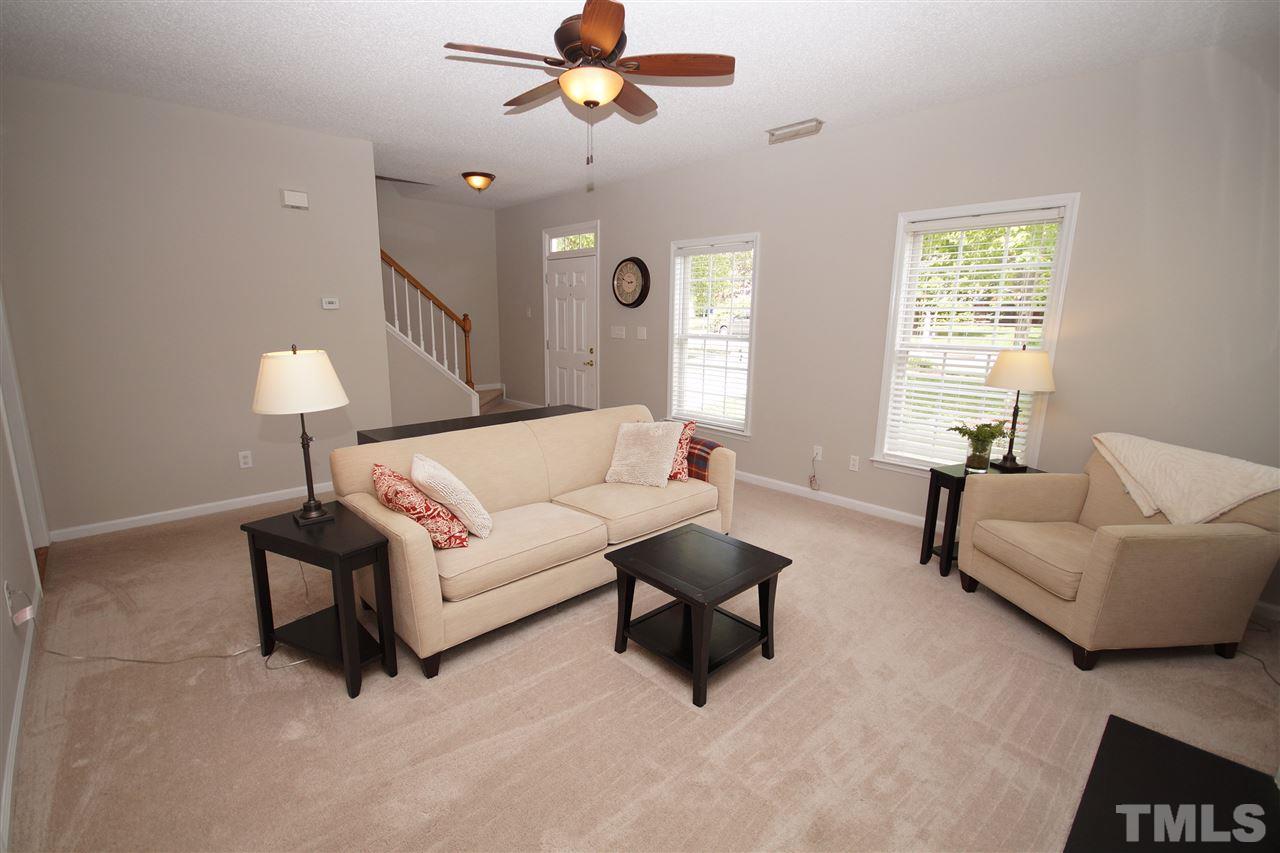 9241 Shallcross Way Raleigh, NC 27617 - Photo 6 of 22 a living room with furniture and a window