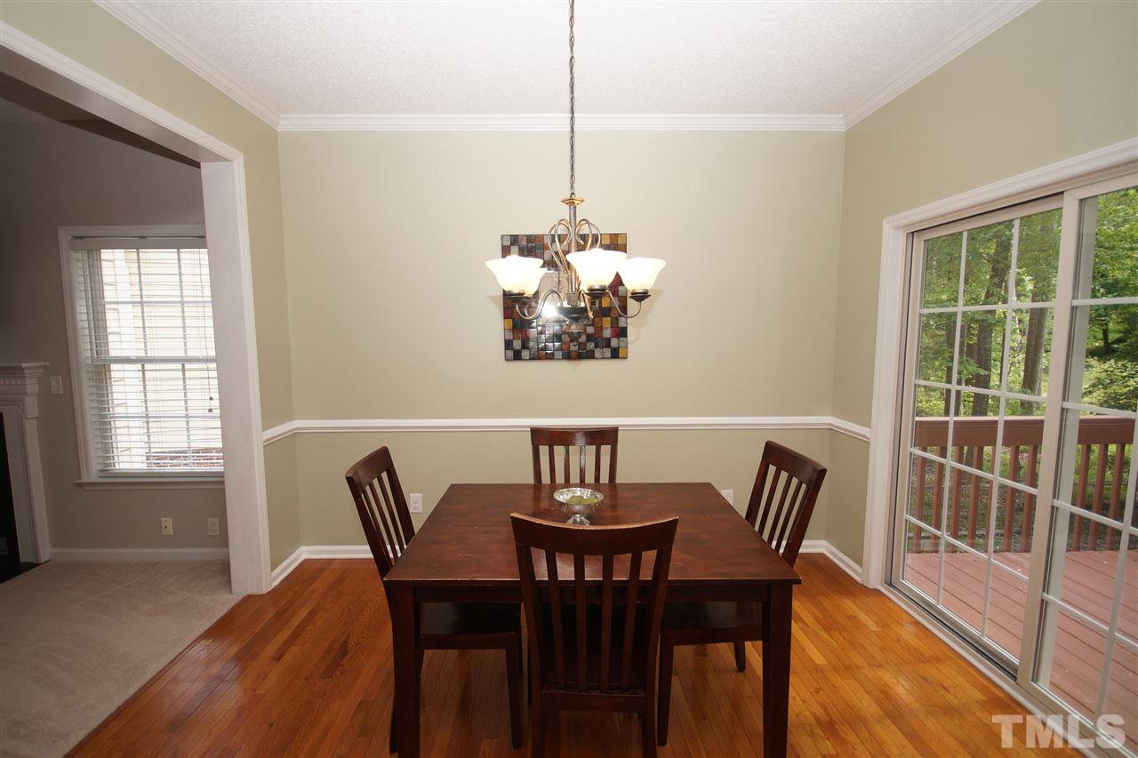 9241 Shallcross Way Raleigh, NC 27617 - Photo 8 of 22 a view of a dining room with furniture window and outside view