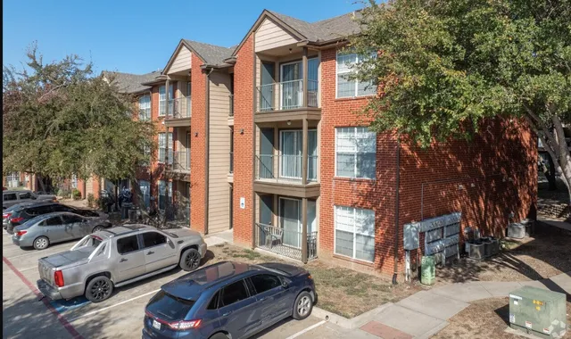 a front view of a house with parking