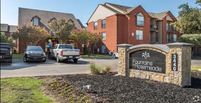 a front view of a building with parking
