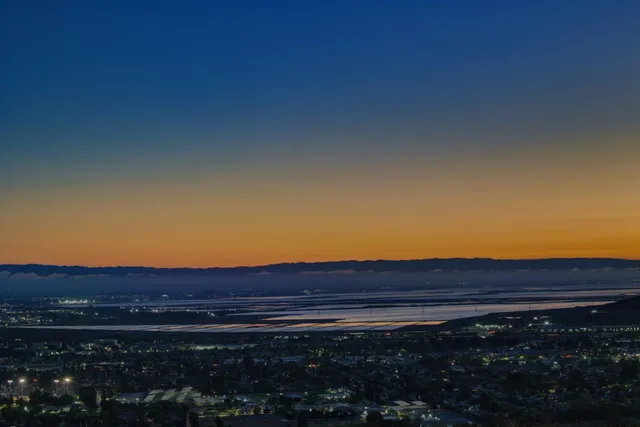 an aerial view of residential house and green space