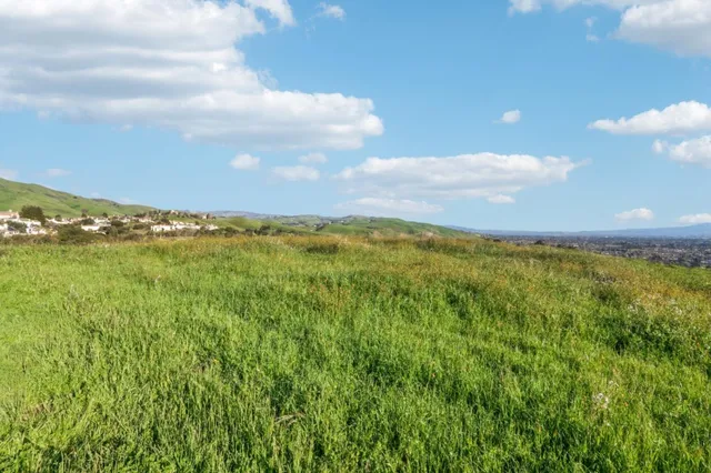a view of a city and mountains in the background
