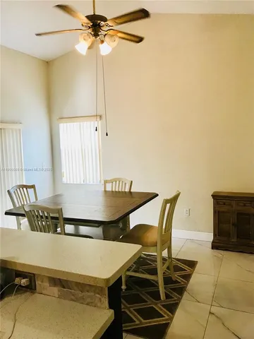 a room with table and chairs