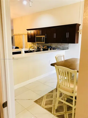 a view of kitchen with furniture