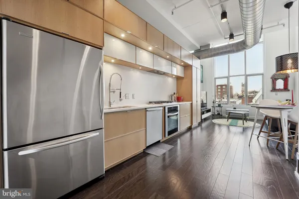 a bathroom with a toilet a sink and a mirror