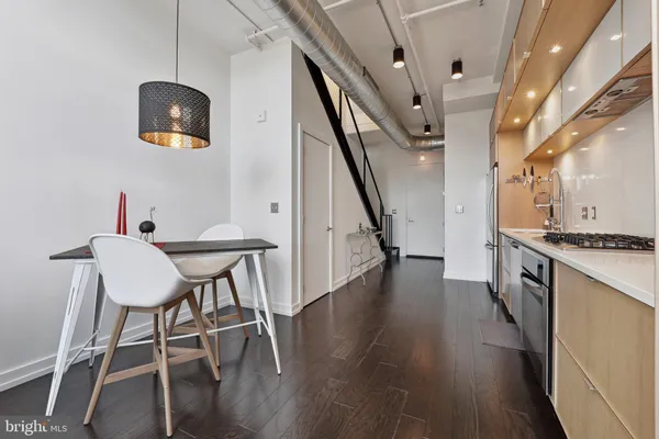 a room with a sink and a refrigerator