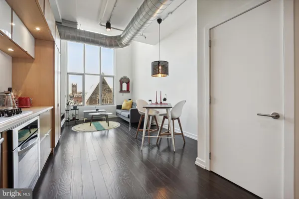 a kitchen with a refrigerator and a stove