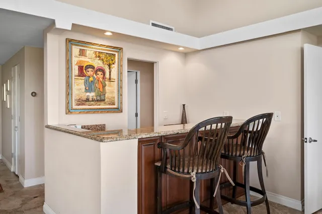 a view of a dining room with furniture and window