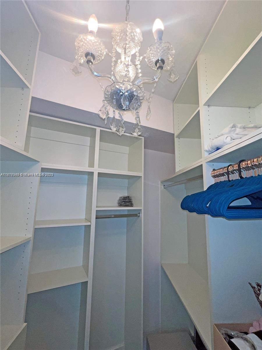 Royal Poinciana Hollywood, FL 33020 - Photo 18 of 26 a view of a chandelier in a room