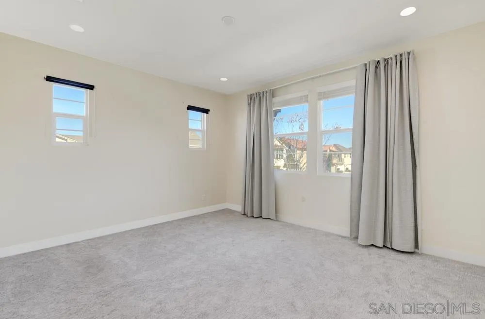4314 Star Path Way, Unit 1 Oceanside, CA 92056 - Photo 15 of 40 an empty room with windows