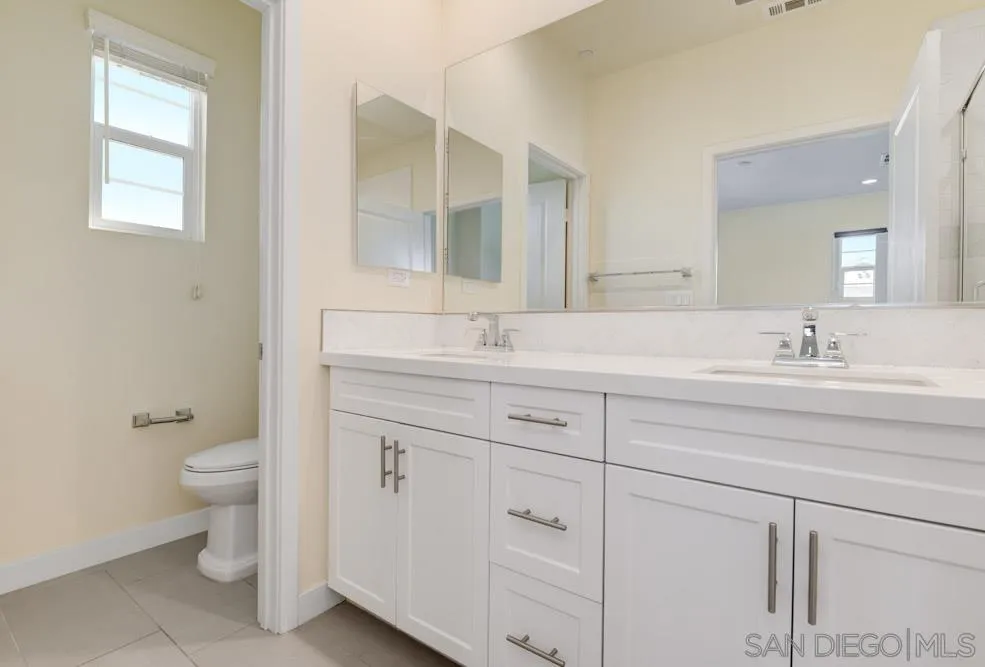 4314 Star Path Way, Unit 1 Oceanside, CA 92056 - Photo 17 of 40 a bathroom with a sink and a toilet