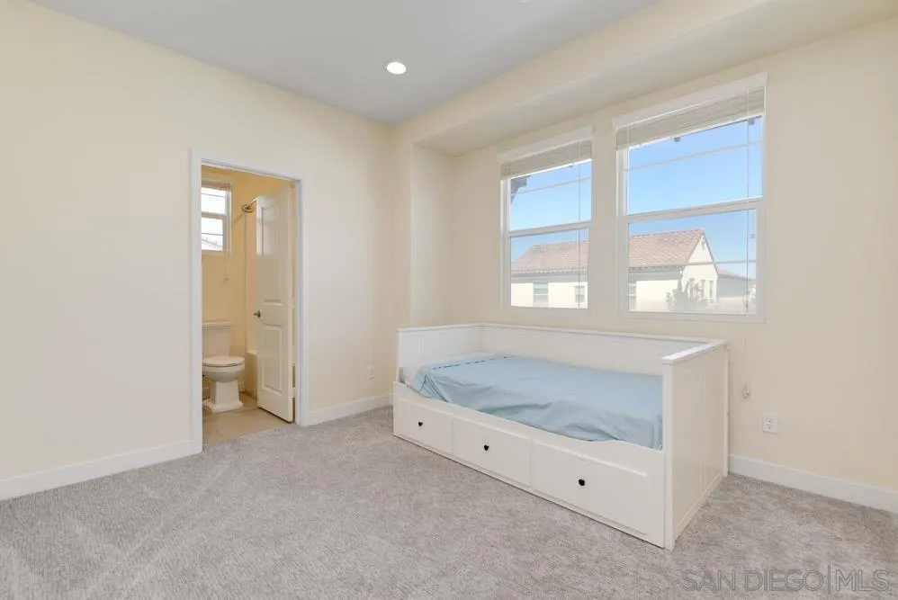 4314 Star Path Way, Unit 1 Oceanside, CA 92056 - Photo 20 of 40 a spacious en suite bathroom with a granite countertop sink and a bathtub