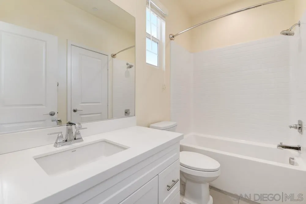 4314 Star Path Way, Unit 1 Oceanside, CA 92056 - Photo 23 of 40 a bathroom with a sink a toilet and a bathtub