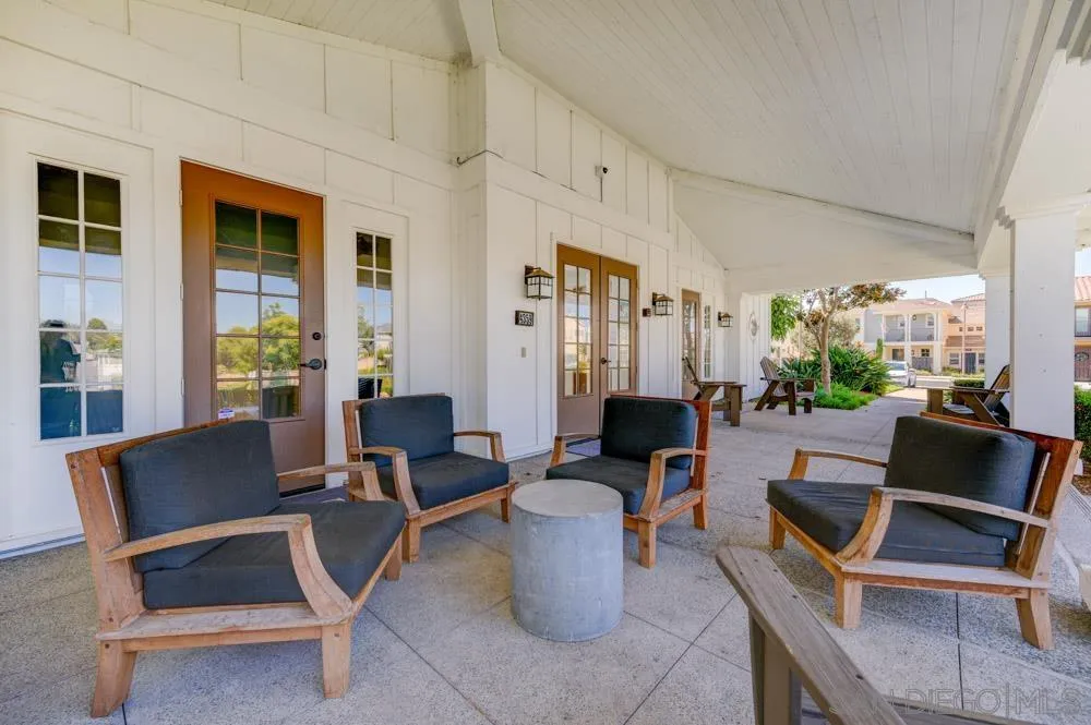 4314 Star Path Way, Unit 1 Oceanside, CA 92056 - Photo 39 of 40 a living room with furniture and a floor to ceiling window