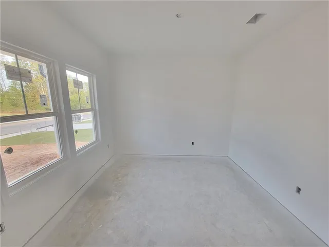 a view of an empty room and window