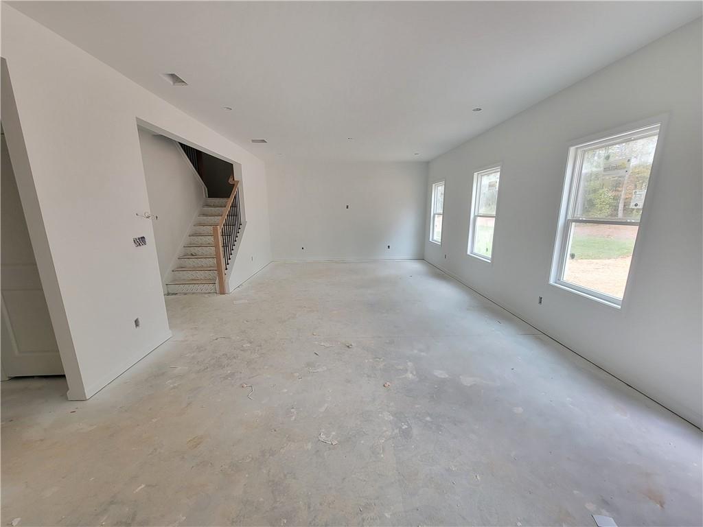 348 Silverleaf Trail Bethlehem, GA 30620 - Photo 10 of 30 a view of empty room with windows