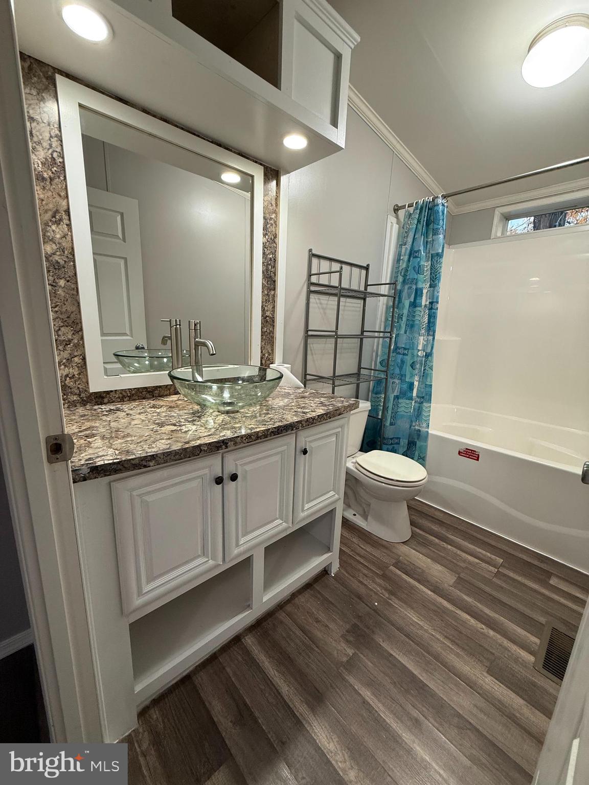 45 Chesapeake Mobile Court Hanover, MD 21076 - Photo 14 of 17 a bathroom with a granite countertop sink toilet and shower