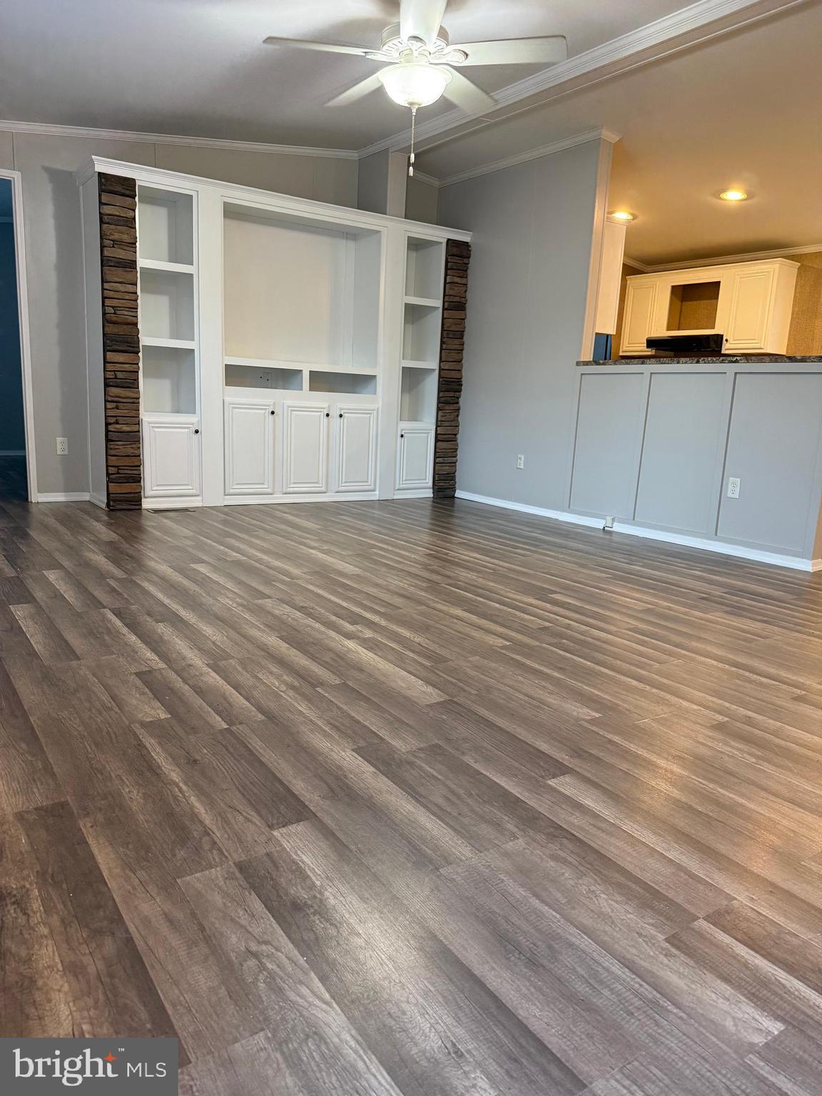 45 Chesapeake Mobile Court Hanover, MD 21076 - Photo 2 of 17 wooden floor in an empty room with a window
