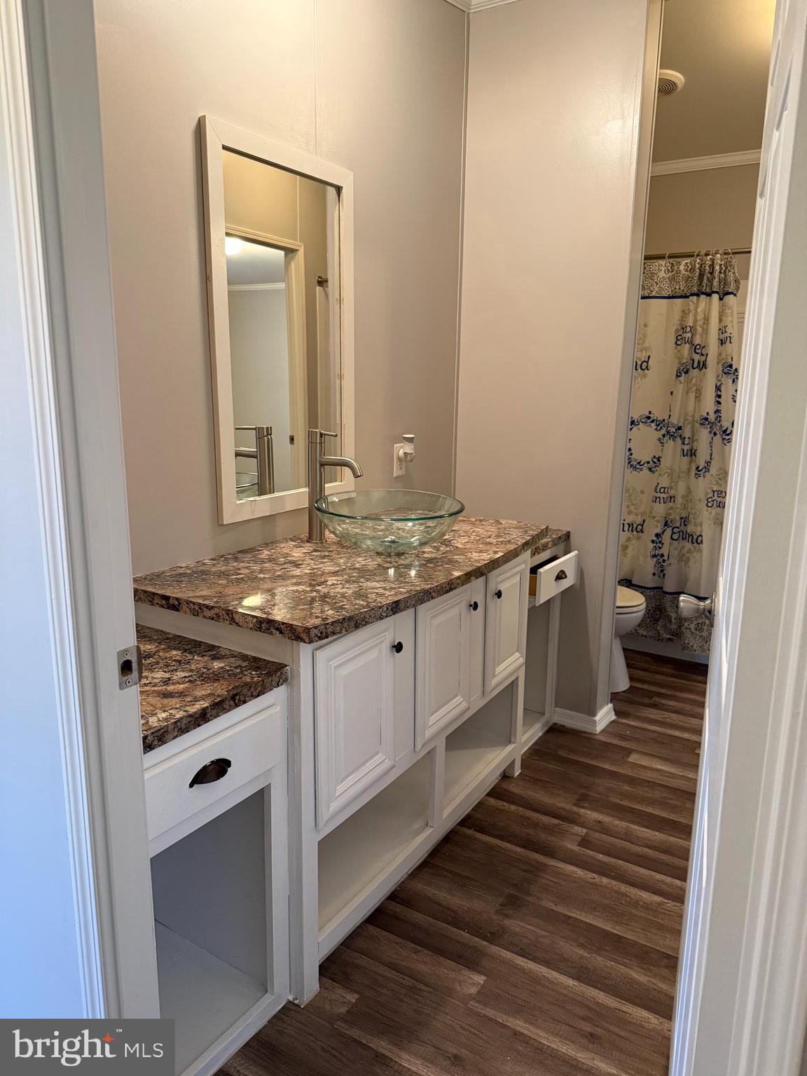 45 Chesapeake Mobile Court Hanover, MD 21076 - Photo 9 of 17 a bathroom with a granite countertop sink and a mirror