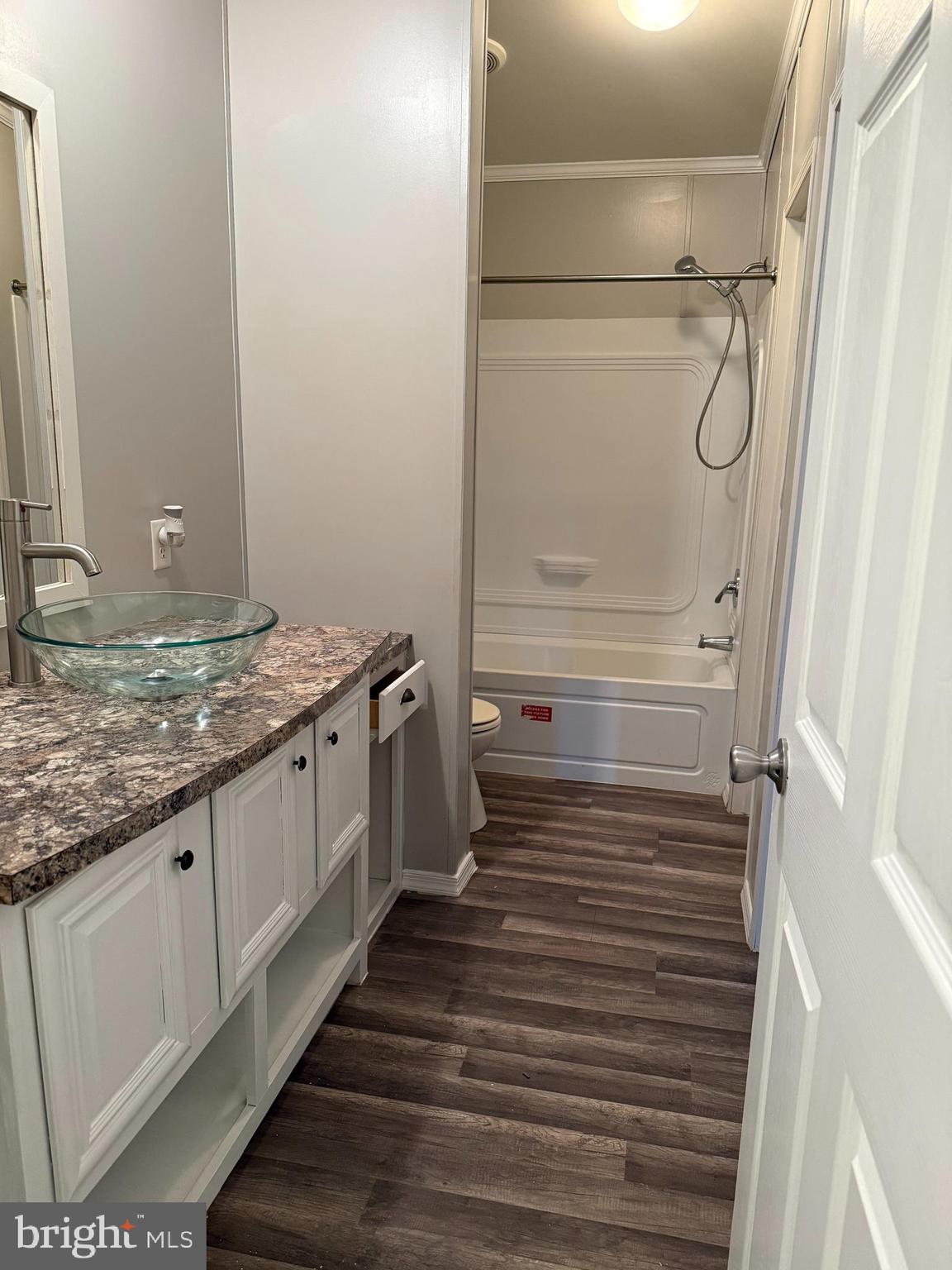 45 Chesapeake Mobile Court Hanover, MD 21076 - Photo 10 of 17 a bathroom with a granite countertop sink and a mirror