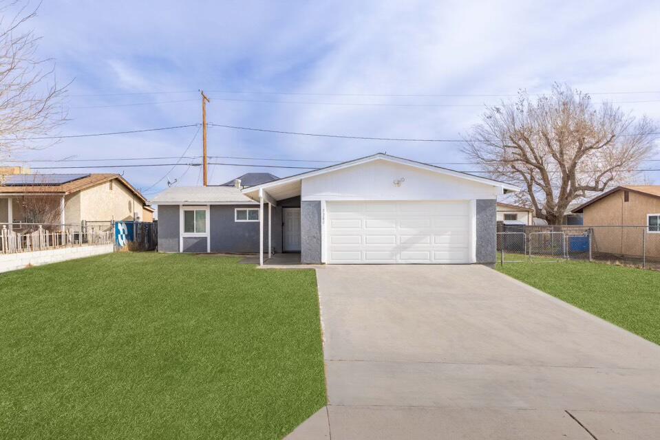 3360 West Roxbury Street Rosamond, CA 93560 - Photo 1 of 23 a view of a yard in front of house