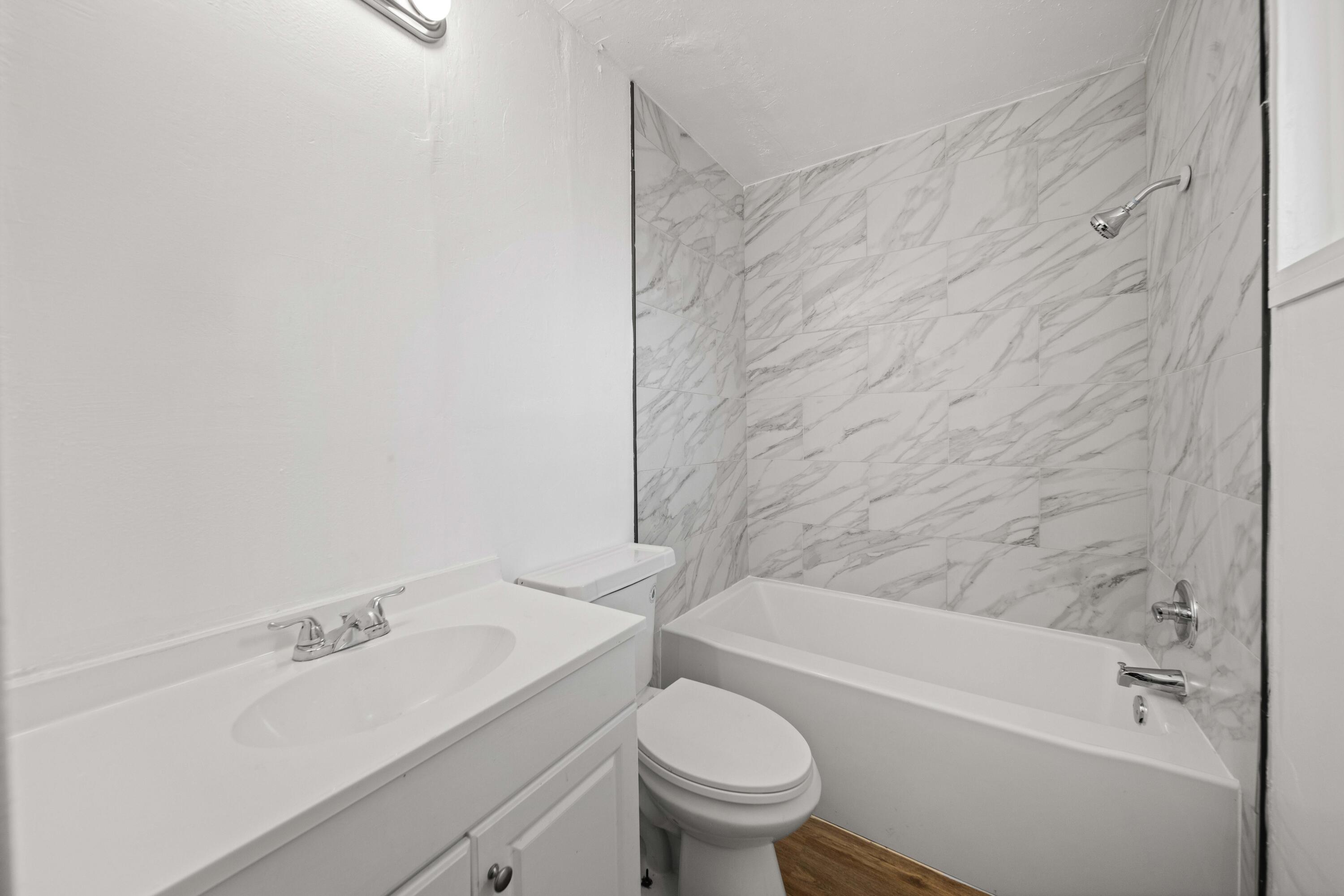 3360 West Roxbury Street Rosamond, CA 93560 - Photo 8 of 23 a bathroom with a sink and a toilet