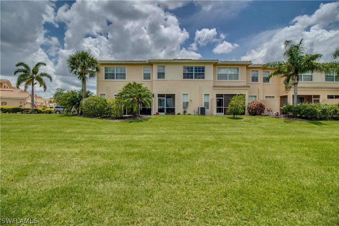 4084 Cherrybrook Loop Fort Myers, FL 33966 - Photo 21 of 29 a view of a house with a big yard and potted plants