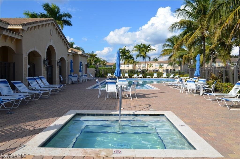 4084 Cherrybrook Loop Fort Myers, FL 33966 - Photo 26 of 29 a view of a swimming pool with outdoor seating