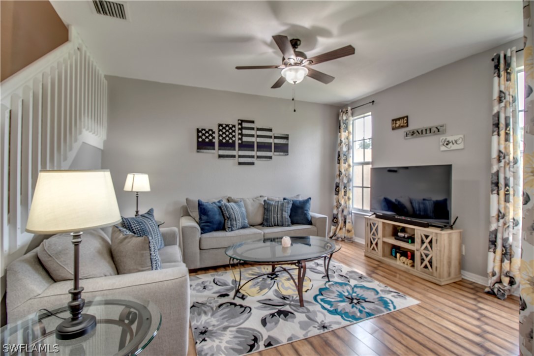 4084 Cherrybrook Loop Fort Myers, FL 33966 - Photo 3 of 29 a living room with furniture and a flat screen tv