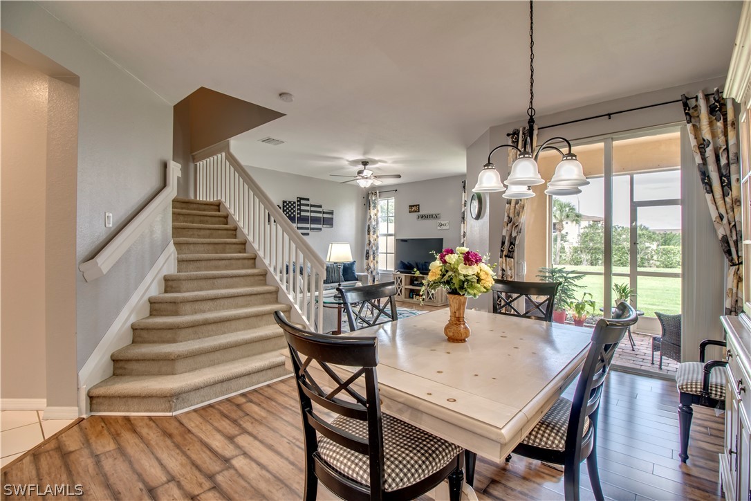 4084 Cherrybrook Loop Fort Myers, FL 33966 - Photo 4 of 29 a view of a dining room with furniture window and wooden floor