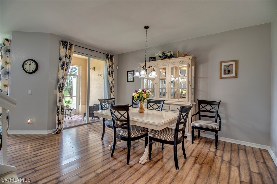 4084 Cherrybrook Loop Fort Myers, FL 33966 - Photo 9 of 29 a view of a dining room with furniture window and wooden floor