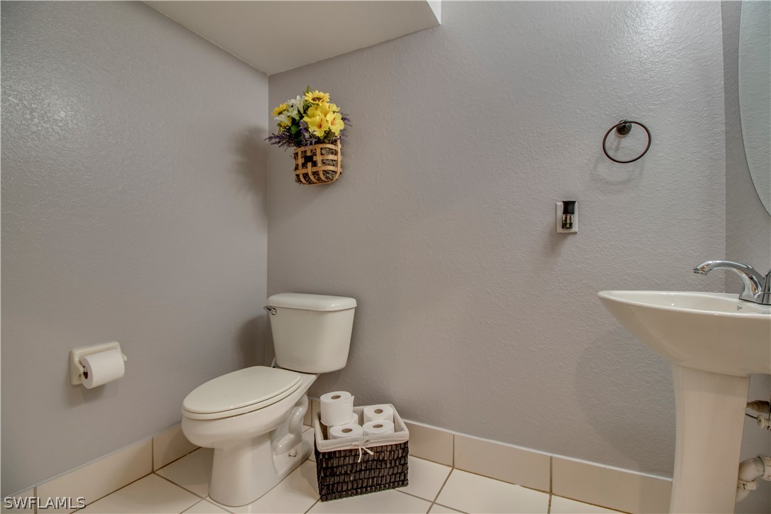 4084 Cherrybrook Loop Fort Myers, FL 33966 - Photo 10 of 29 a bathroom with a toilet and a sink